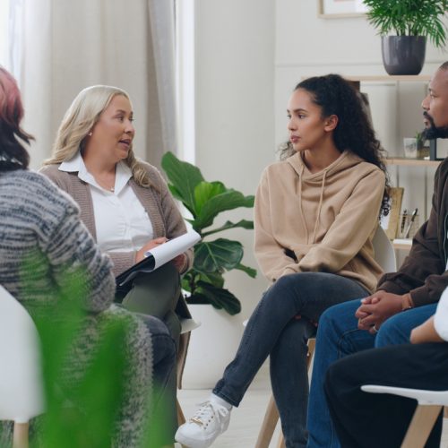 Diversity, mental health and group therapy counseling support meeting, healthy conversation and wellness. Psychology counselor, psychologist help people and talk about anxiety, depression or stress